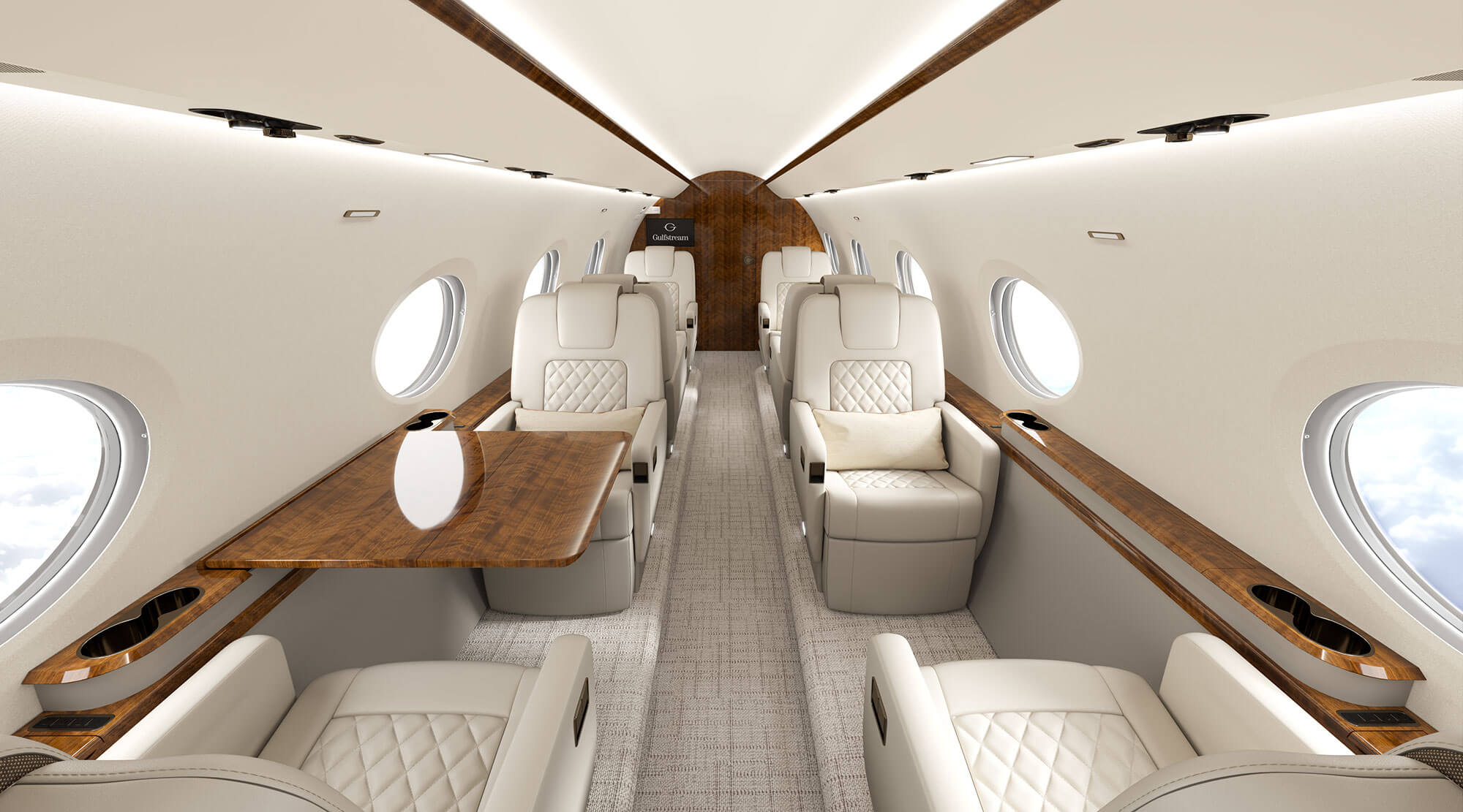 A G300 interior showcases comfortable seating with stiched leather seatbacks and elegant wood trim in natural light from iconic Gulfstream Panoramic Oval Windows.