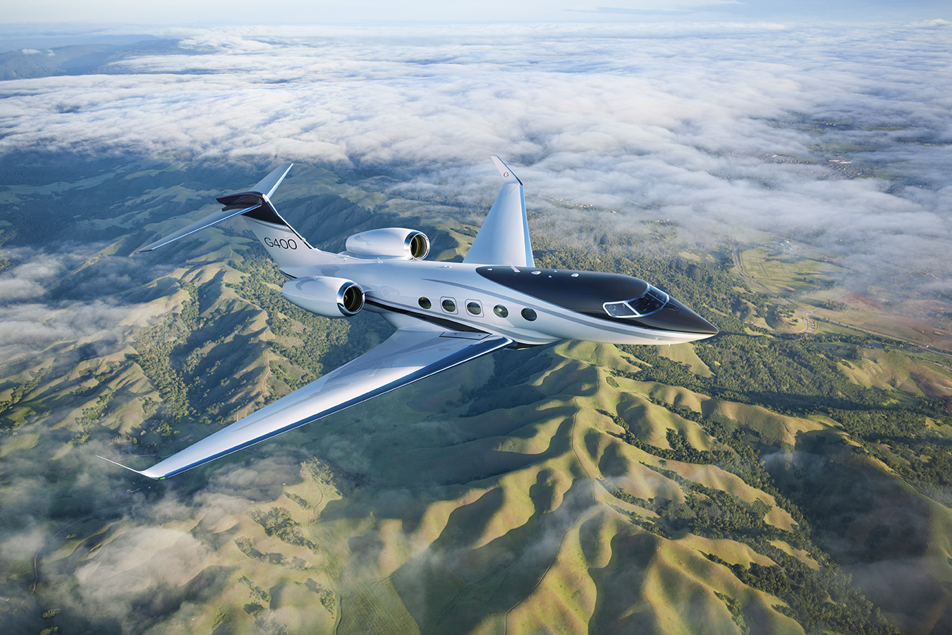 G400 flying over a mountain range