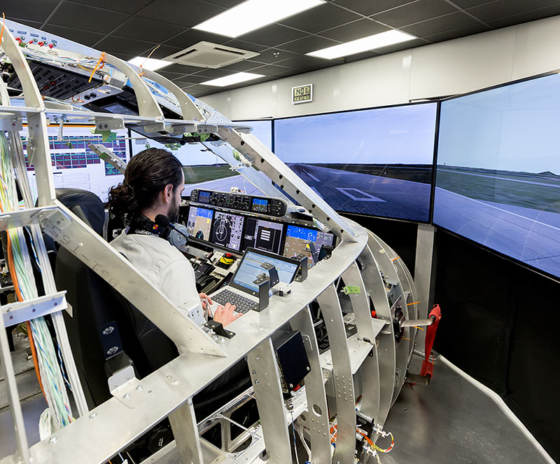 A Gulfstream Aerospace employee works to improve flight safety in a simulator.